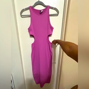 Cute pink dress. With cutouts on the side. And a slit in the back.